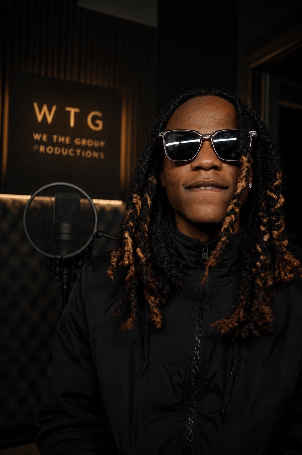 KG, founder of We The Group Productions, in the WTG studio