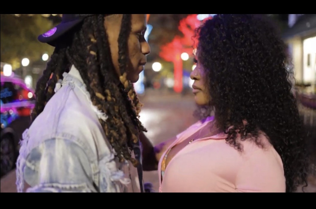 Cinematic still from a WTG music video